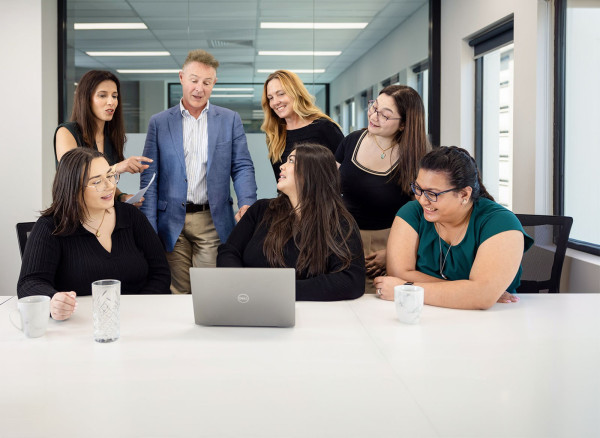 A group of people in an office.