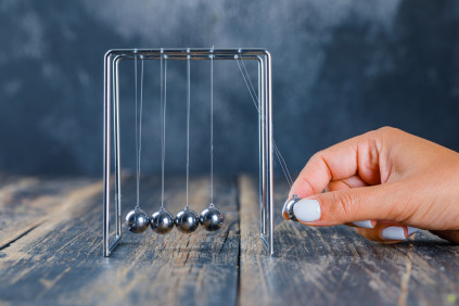 Hand balancing ball newton s cradle